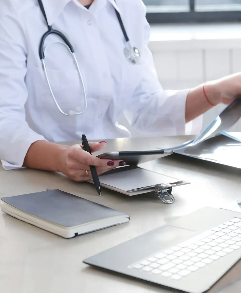 Medicine. Beautiful doctor by the table